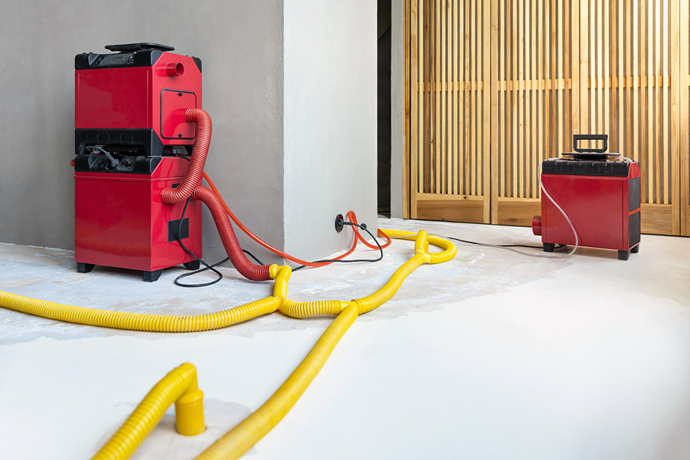 Red power vacuum on previously flooded ground used by our water damage restoration company near Bloomington, California.